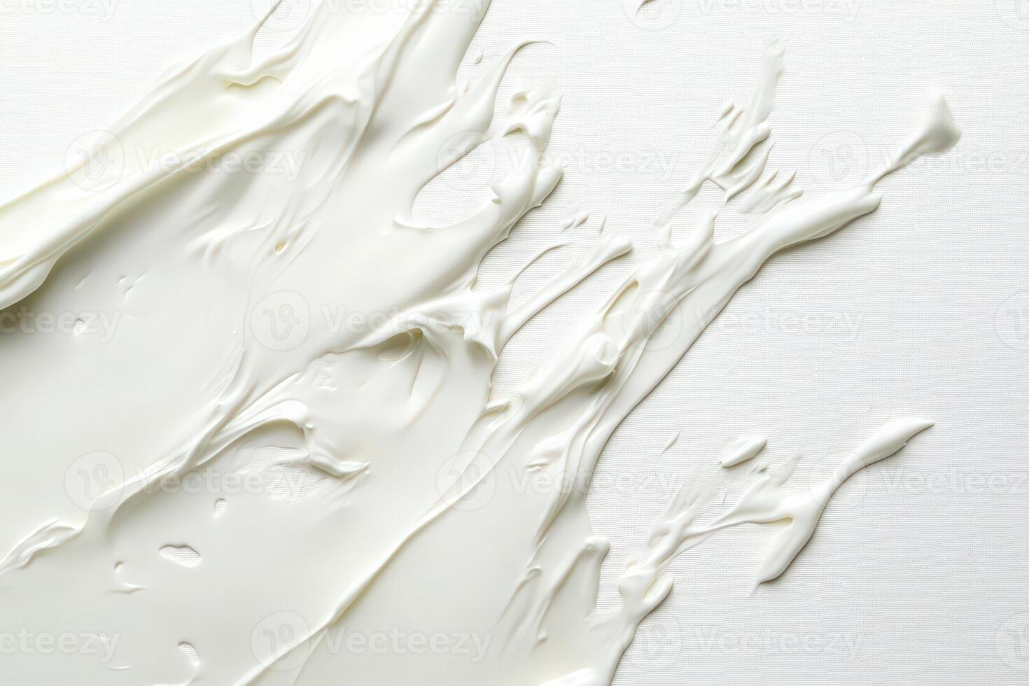 The image captures heavy cream spread across a textured surface, revealing its rich and creamy consistency. This versatile ingredient is often used in various culinary applications. photo