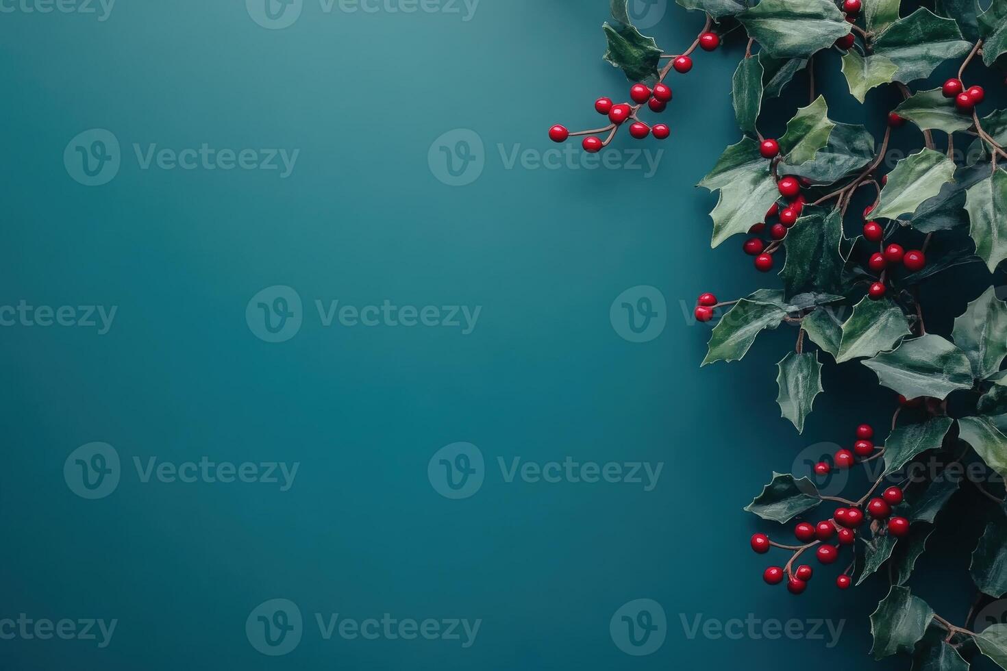 Bright holiday garlands featuring lush green leaves and vivid red berries are elegantly arranged on a solid teal background, creating a festive and cheerful atmosphere perfect for celebrations. photo