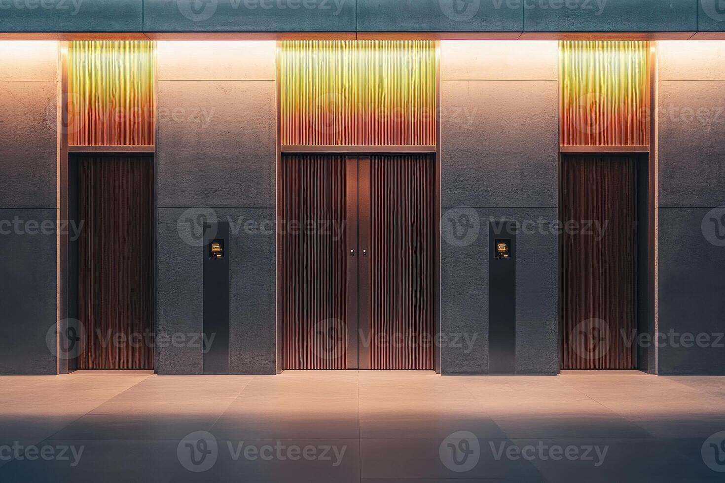 The setting features sleek elevator doors with a wooden finish and soft ambient lighting, enhancing the minimalist design of a modern buildings interior during dusk. photo