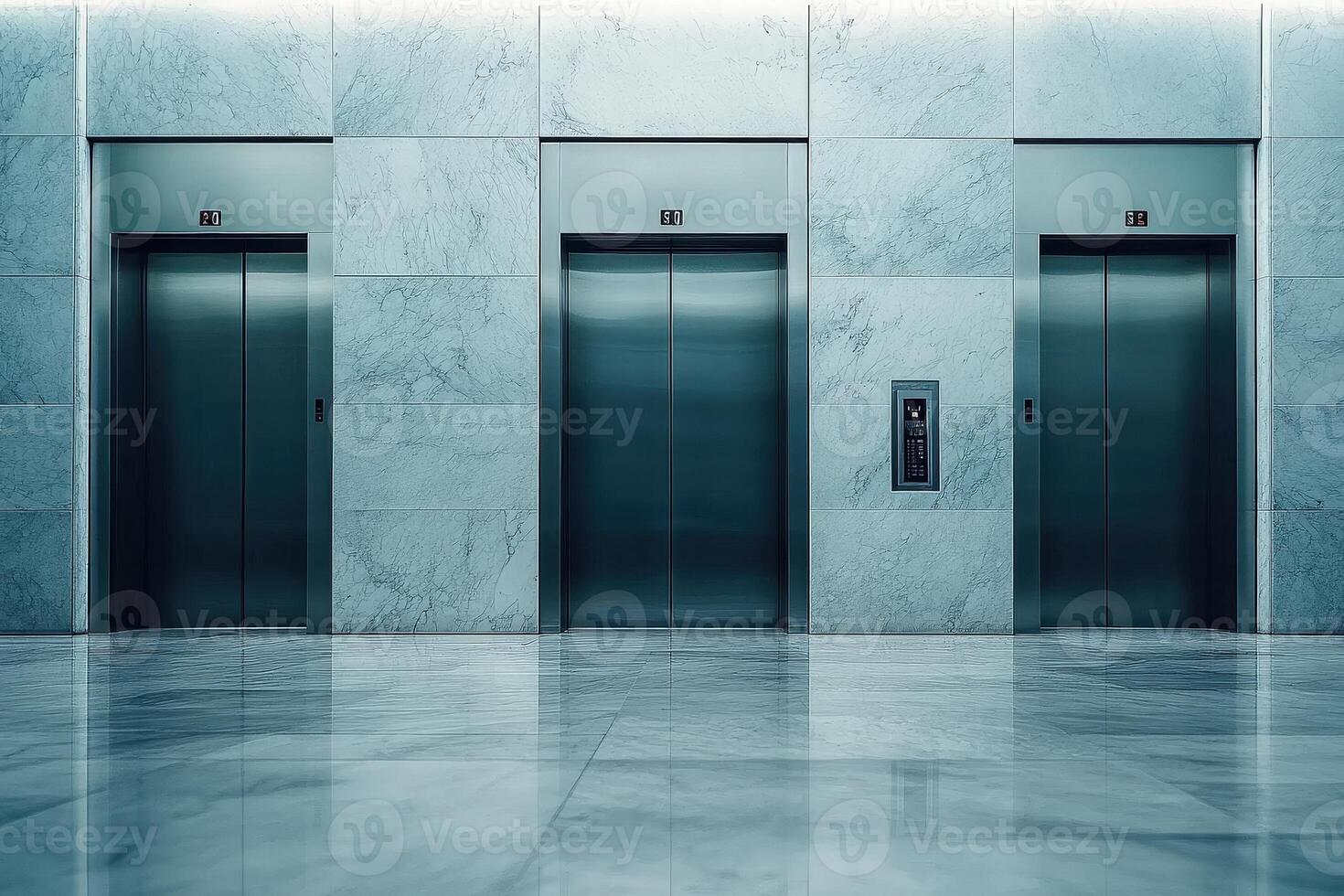The sleek, minimalist design of elevator doors is showcased in a modern lobby featuring smooth marble walls and flooring, offering an inviting and sophisticated atmosphere. photo