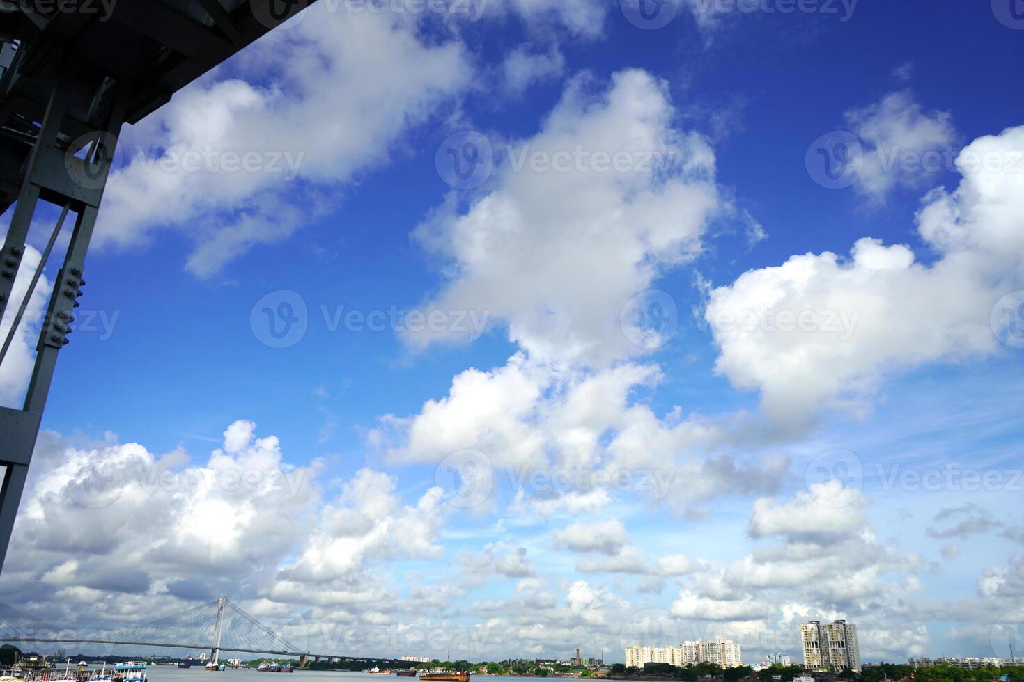 View of Vidyasagar Setu from Babughat with cityscape photo