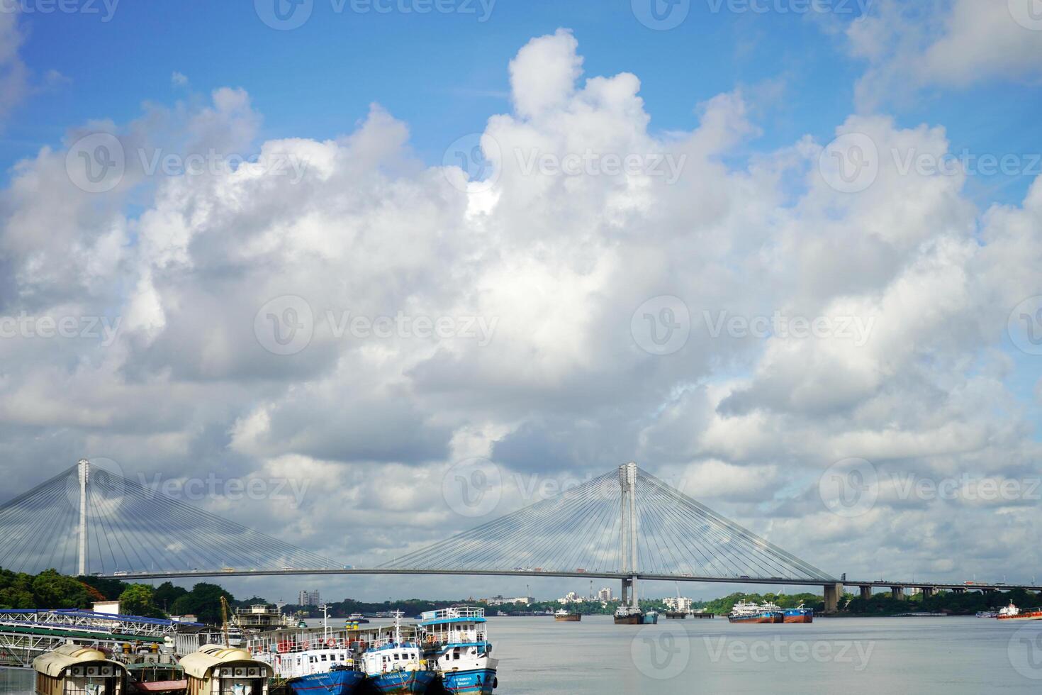 Ship tied at Kolkata Ganga Ghat, Vidyasagar Setu in background photo