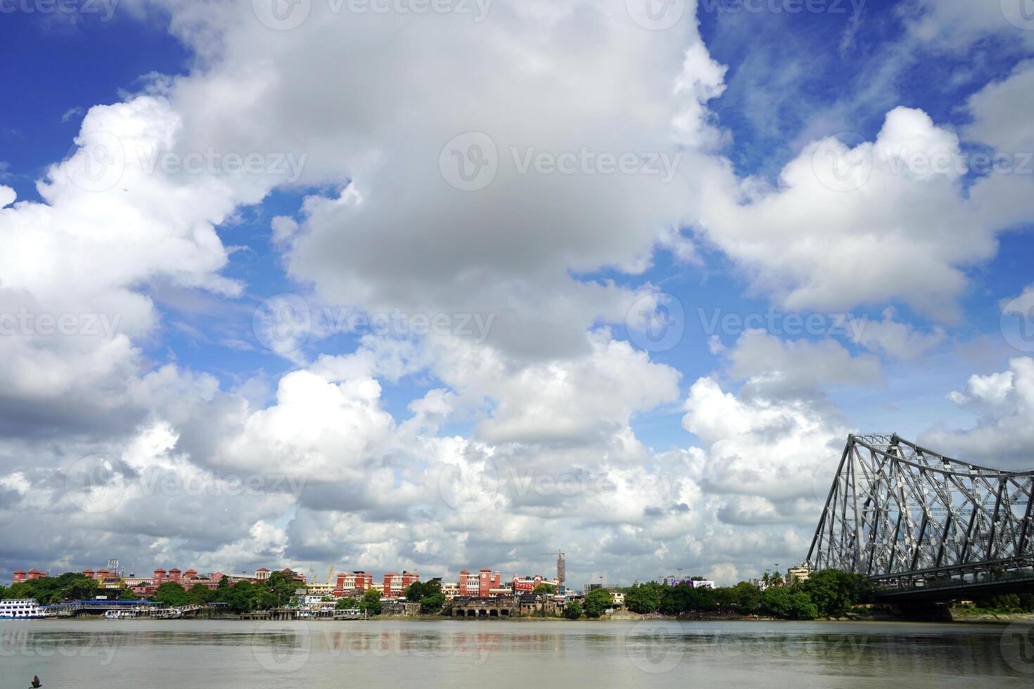 Howrah bridge on the river Ganges with a view of Howrah Station photo