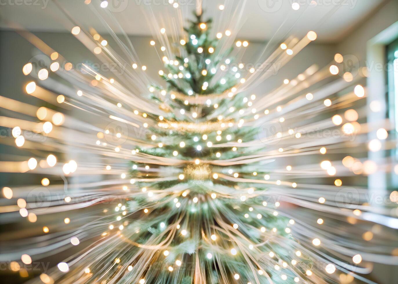 Slow shutter speed shot of Christmas tree lights twinkling in a dark room, creating streaks of color photo