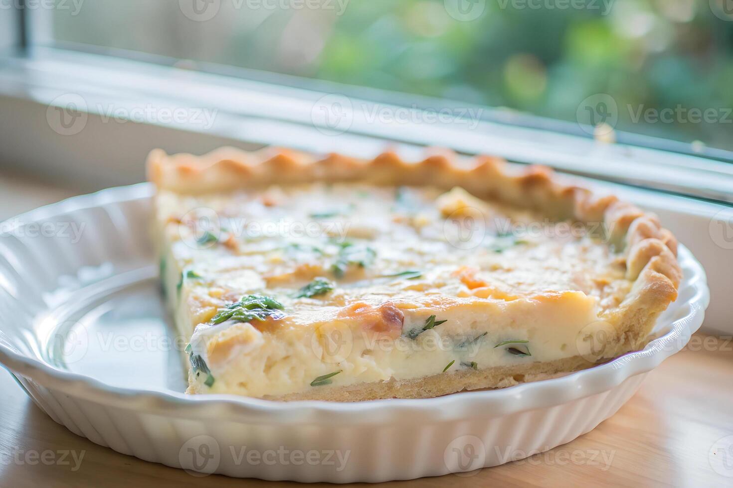 A delicate wheat crust quiche filled with spinach and cheese photo