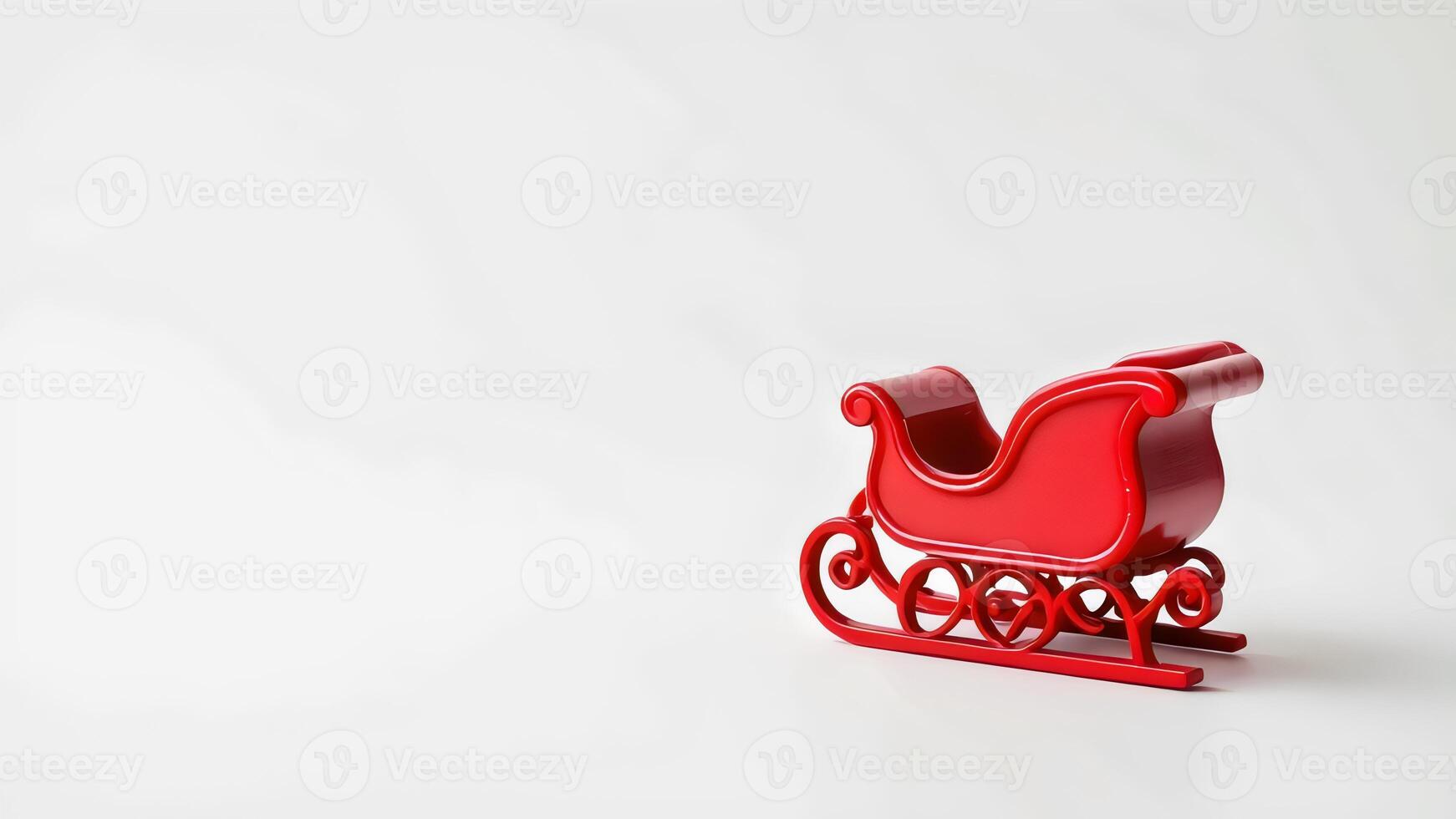 A red toy sleigh on a white background photo
