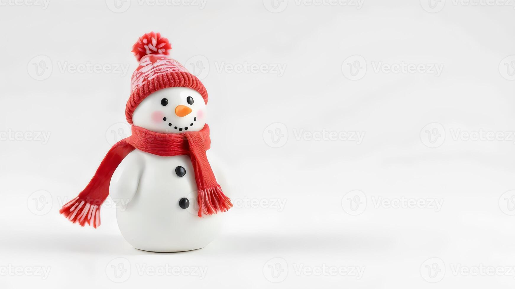 A snowman with a red scarf and hat photo