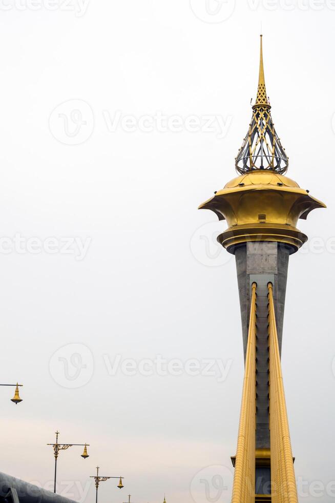 Beautifully decorated structure at the top of the bridge tower photo