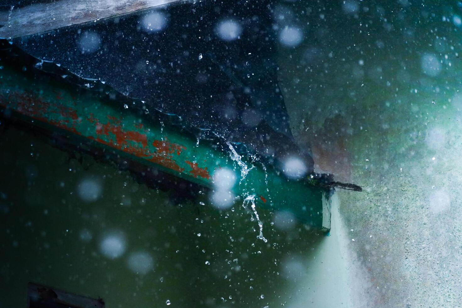The atmosphere of a house roof being drenched in rain is suitable as a background photo