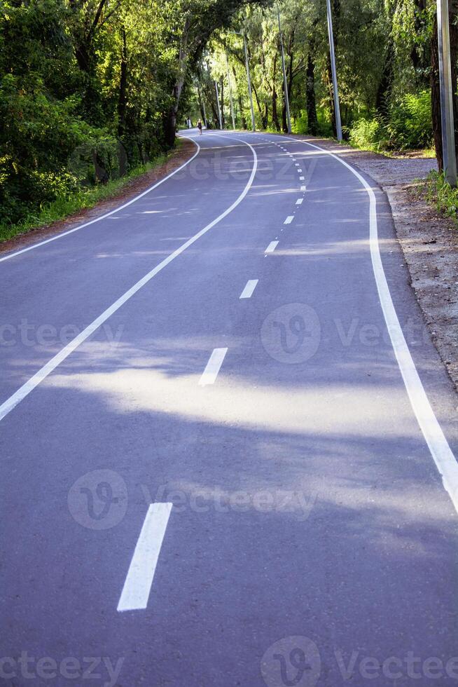 A road with white lines on it photo