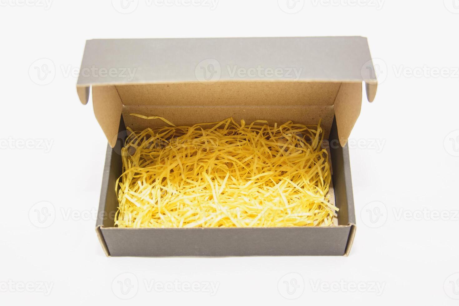 A box with yellow shredded cheese inside photo