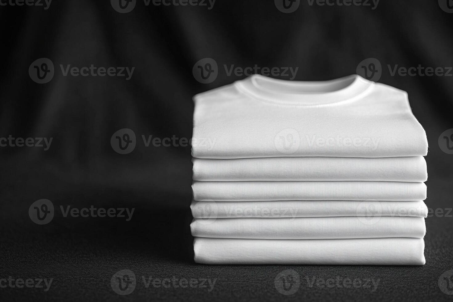 A neat stack of white t-shirts on a black background. Generated by artificial intelligence photo