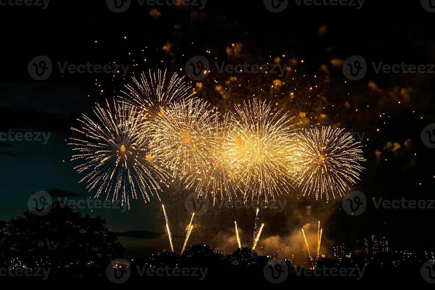 The night sky above the city is illuminated by powerful golden fireworks. The background for birthday celebrations, major events, congratulations and holidays. photo