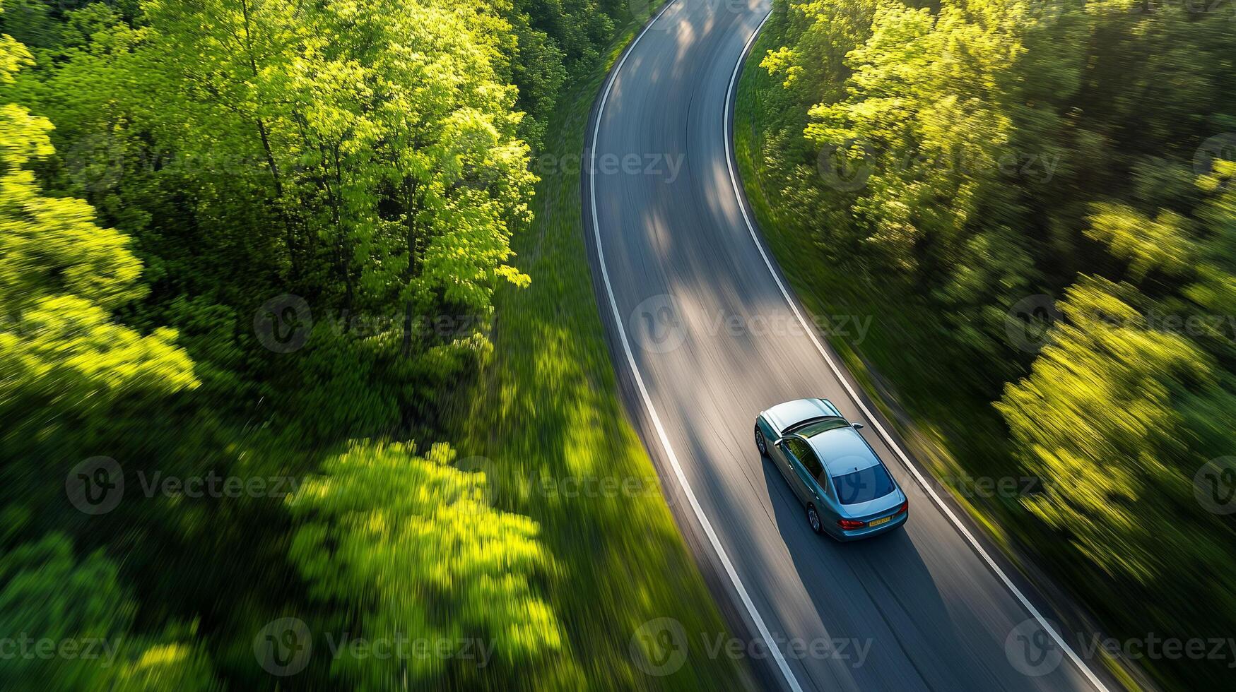 Car in rural area in deep rain forest with green tree view from above, Aerial view of a car in open path road with speed motion background. photo