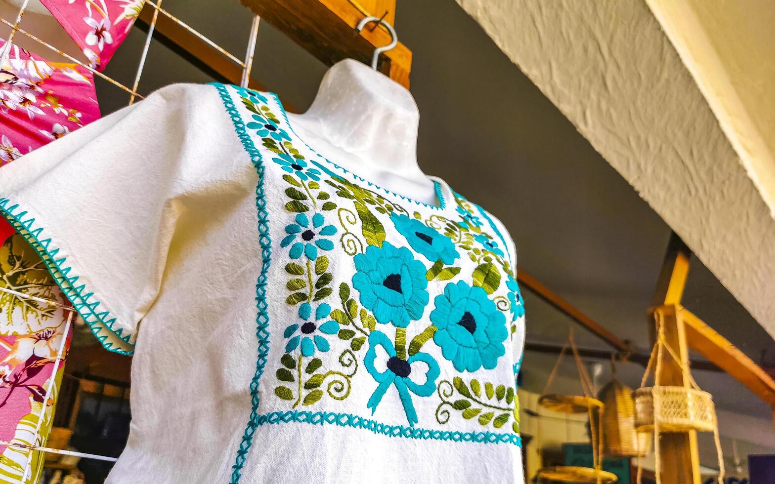 Puerto Escondido Oaxaca Mexico 2023 Mexican souvenirs womens clothing dresses shorts hats souvenir shop Mexico. photo
