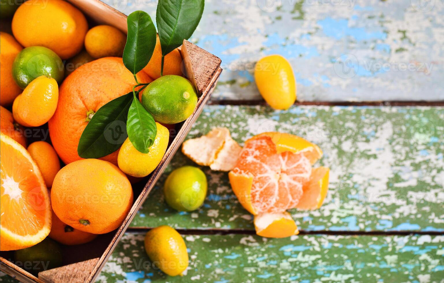 Fresh citrus fruits in the wooden box photo