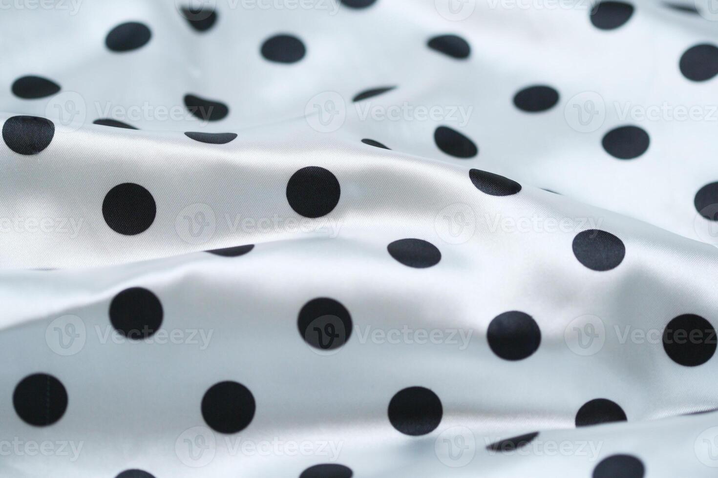 a close up of a polka dot fabric photo