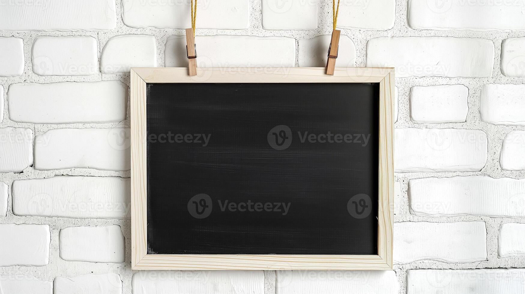 Decorative blackboard hanging on rope mockup. Notice board with wooden frame on white wall template advertising image. Chalkboard mock up in interior product photorealistic photo