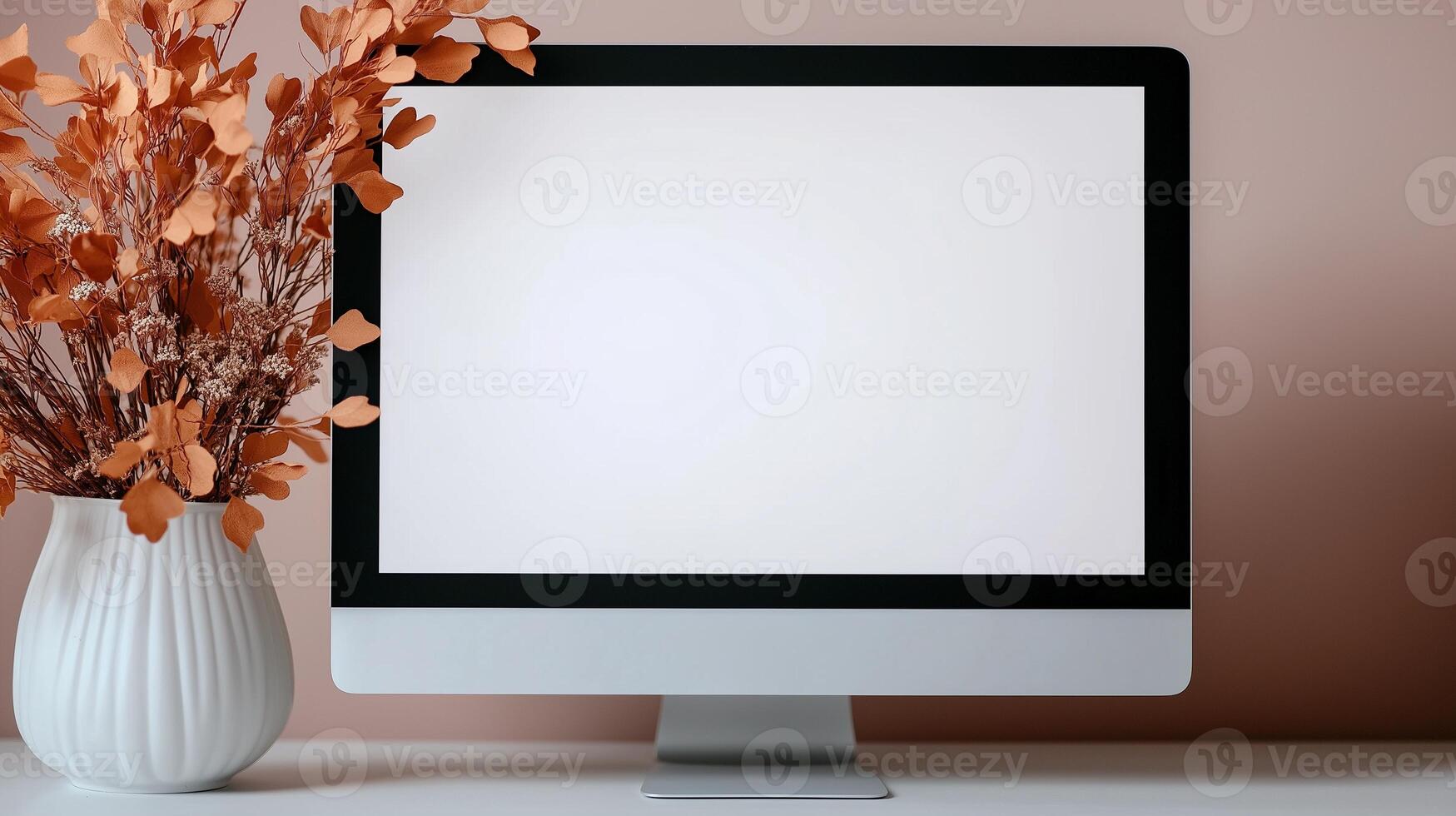 Mockup monitor and dried flowers bouquet on desk. Autumn decor of office workplace template advertising image. Digital equipment screen mock up indoors product photorealistic photo