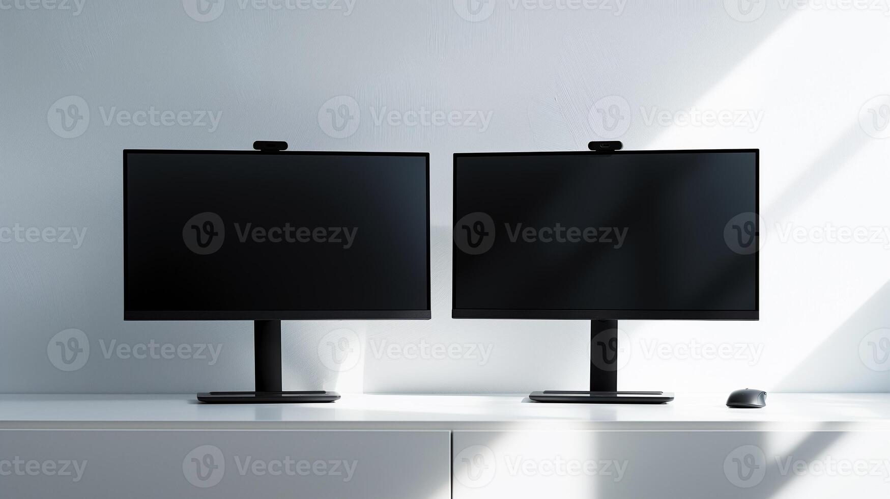 Mockup computer displays on desk by white wall. Minimalist it company office interior with pc monitors template advertising image. Modern screens mock up product photorealistic photo