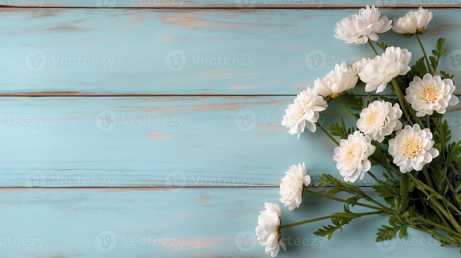 Chrysanthemums bouquet on blue wooden table banner background copy space. Fresh flowers on rustic desk image backdrop empty. Floral design concept composition top view, copyspace photo