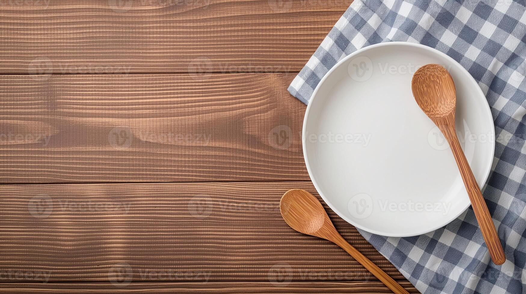Plate with spoons and towel on table banner background copy space. Country kitchen setting with utensils image backdrop empty. Cookery tools concept composition top view, copyspace photo