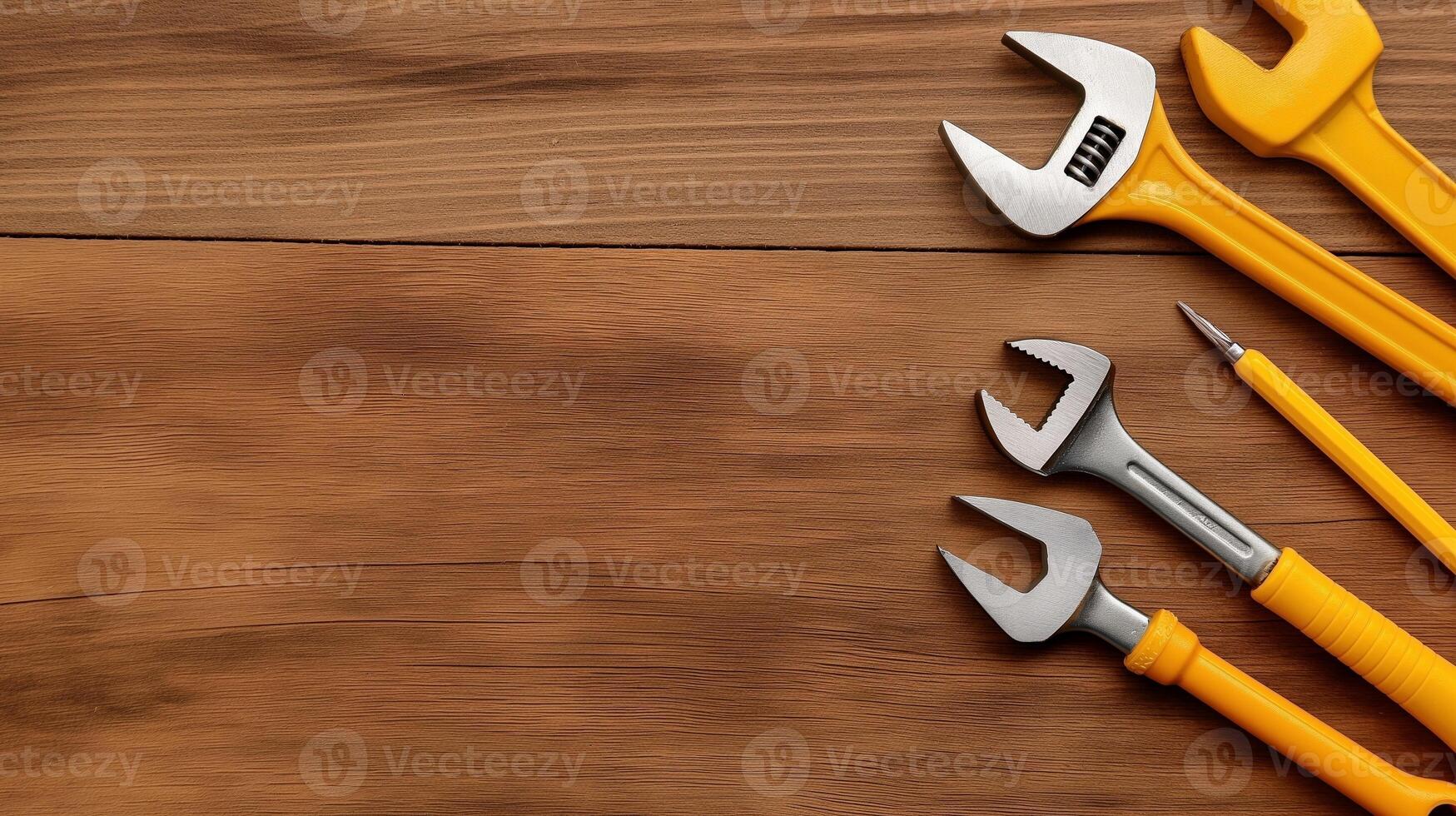 Spanners with plastic handles on wooden table banner background copy space. Manual tools border image backdrop empty. Maintenance supplies concept composition top view, copyspace photo