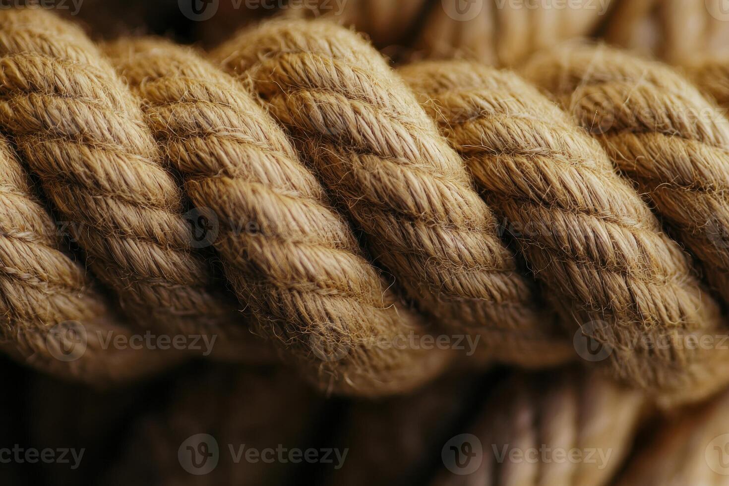 Natural jute rope coiled tightly, showcasing texture and craftsmanship in natural lighting photo