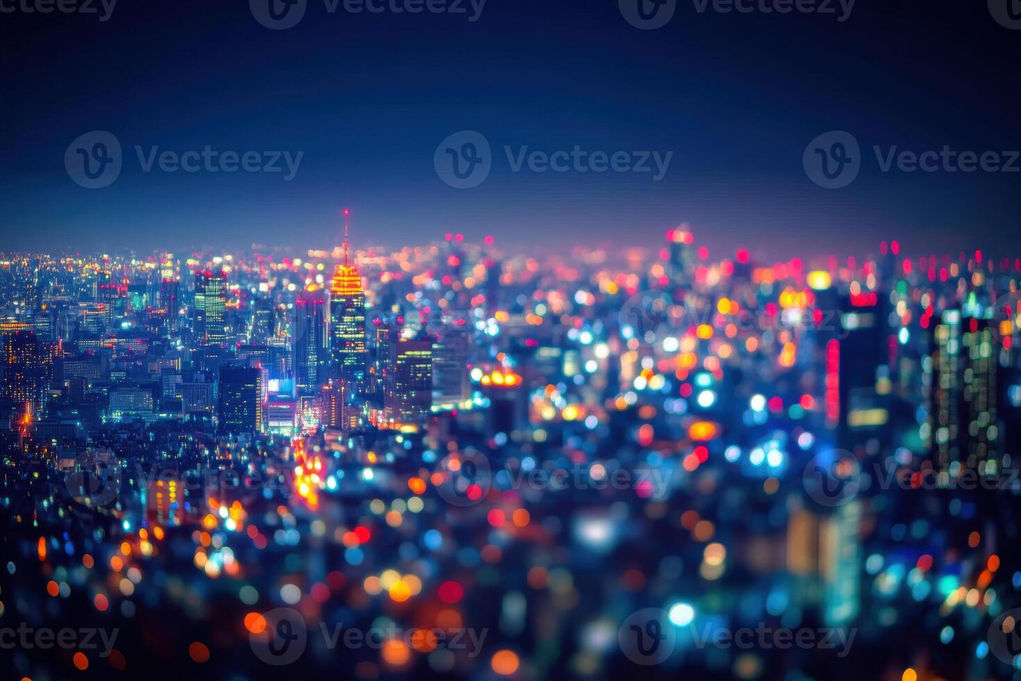 Nighttime cityscape of Tokyo illuminated by vibrant lights during a clear evening photo