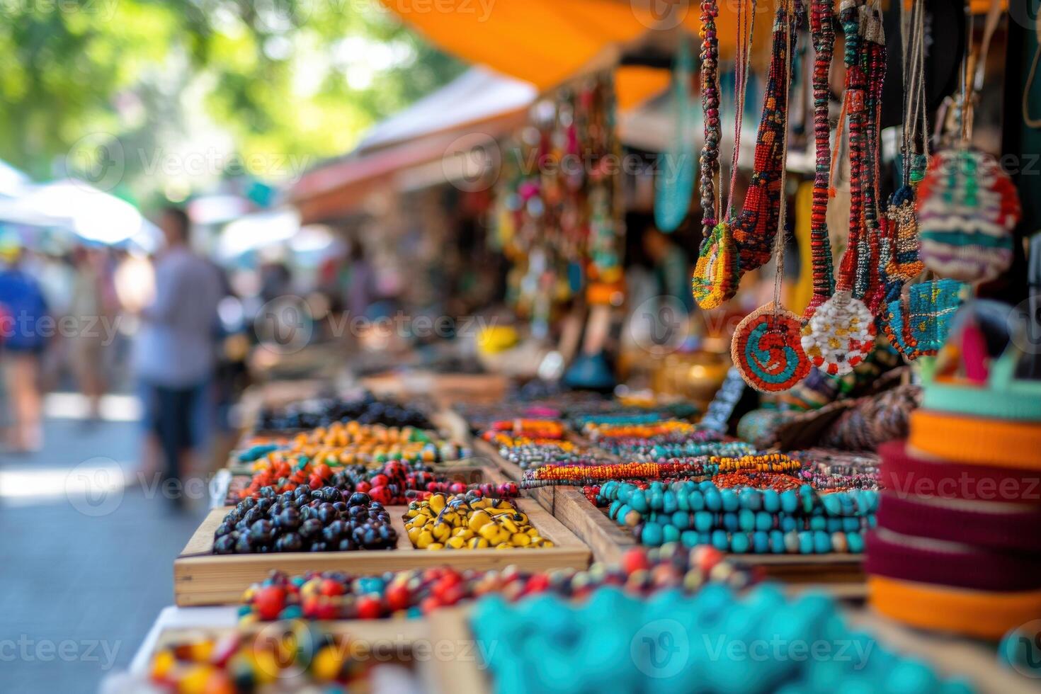 Vibrant market filled with handmade jewelry and colorful crafts in a bustling outdoor setting photo