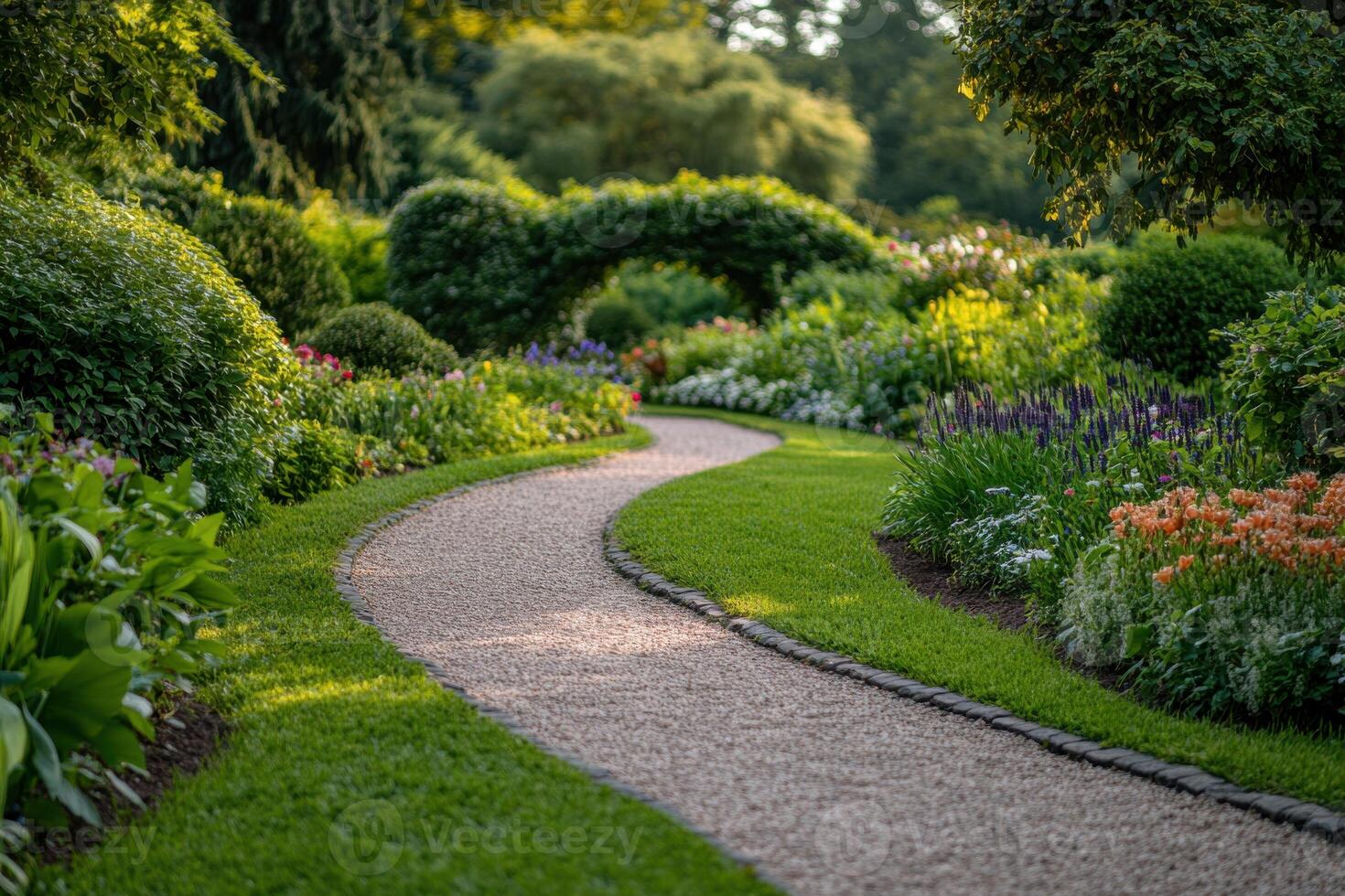 A winding garden path surrounded by vibrant flowers and lush greenery in summer photo