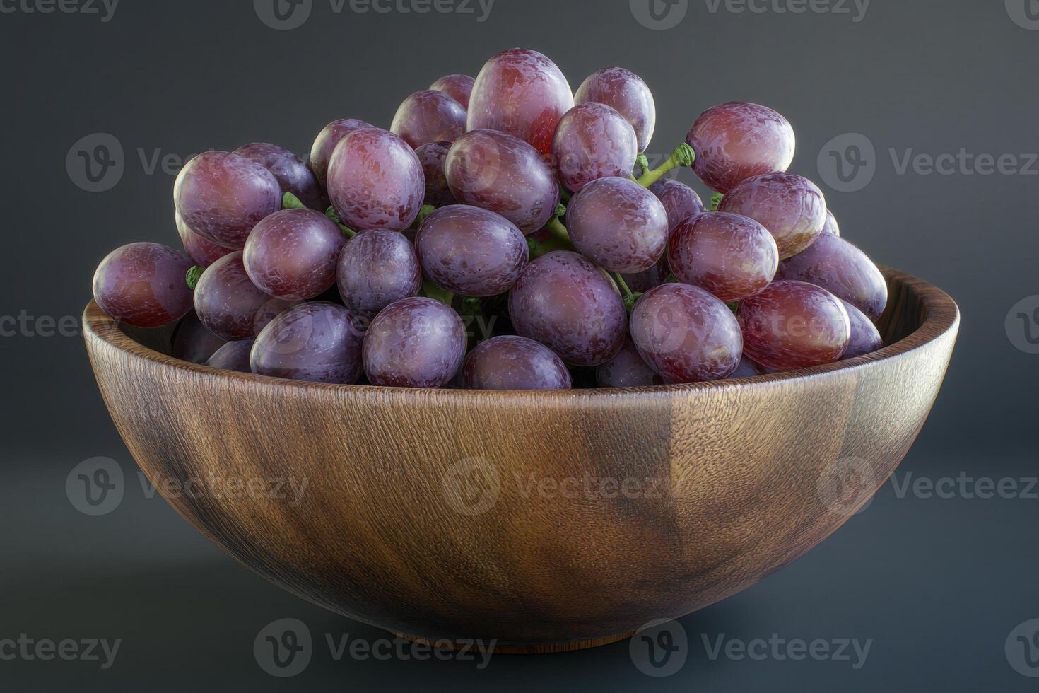 Bowl of fresh purple grapes on a dark background highlighting natural textures and colors photo