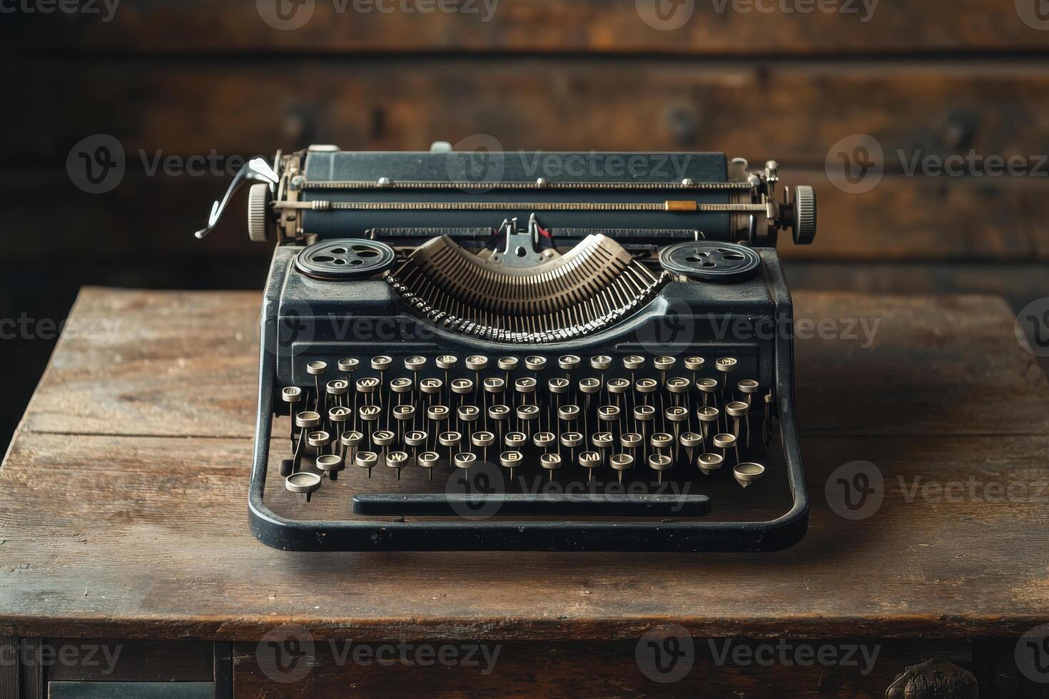 Vintage black typewriter on a wooden table with rustic background highlighting classic design photo