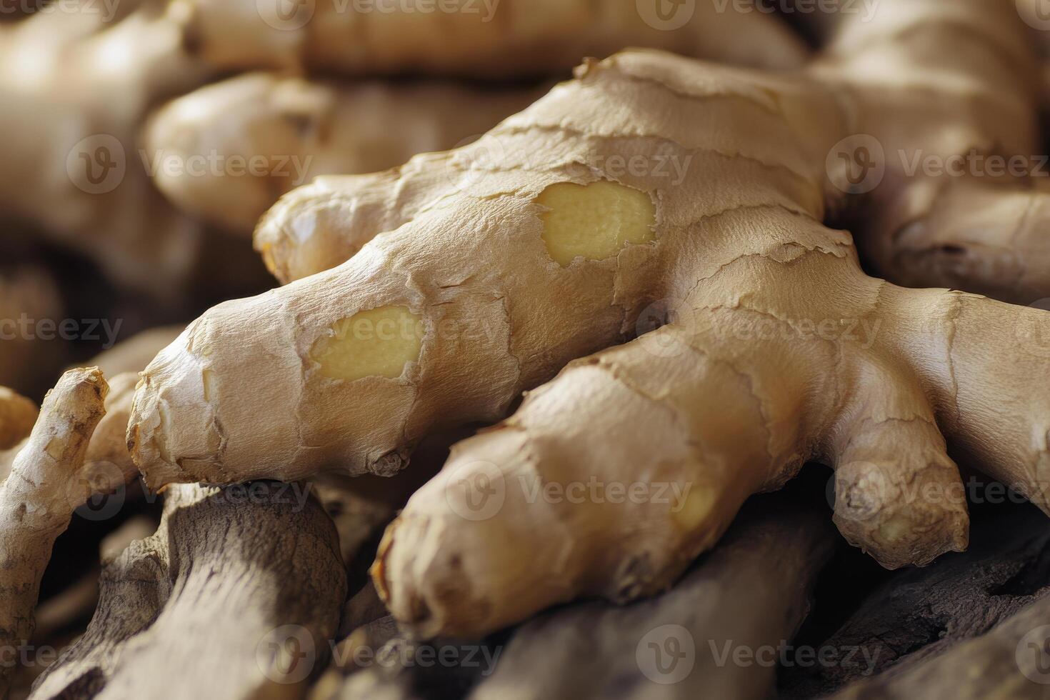 Fresh ginger root on a rustic wooden surface, highlighting its texture and organic shapes photo