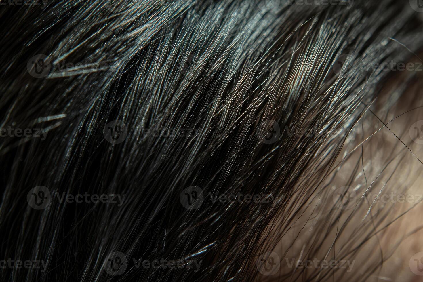 Close-up of black hair strands reflecting light under natural conditions during daylight photo