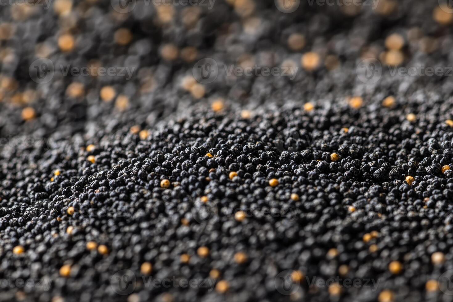 Close-up view of scattered black mustard seeds on a textured surface at a farmer's market photo