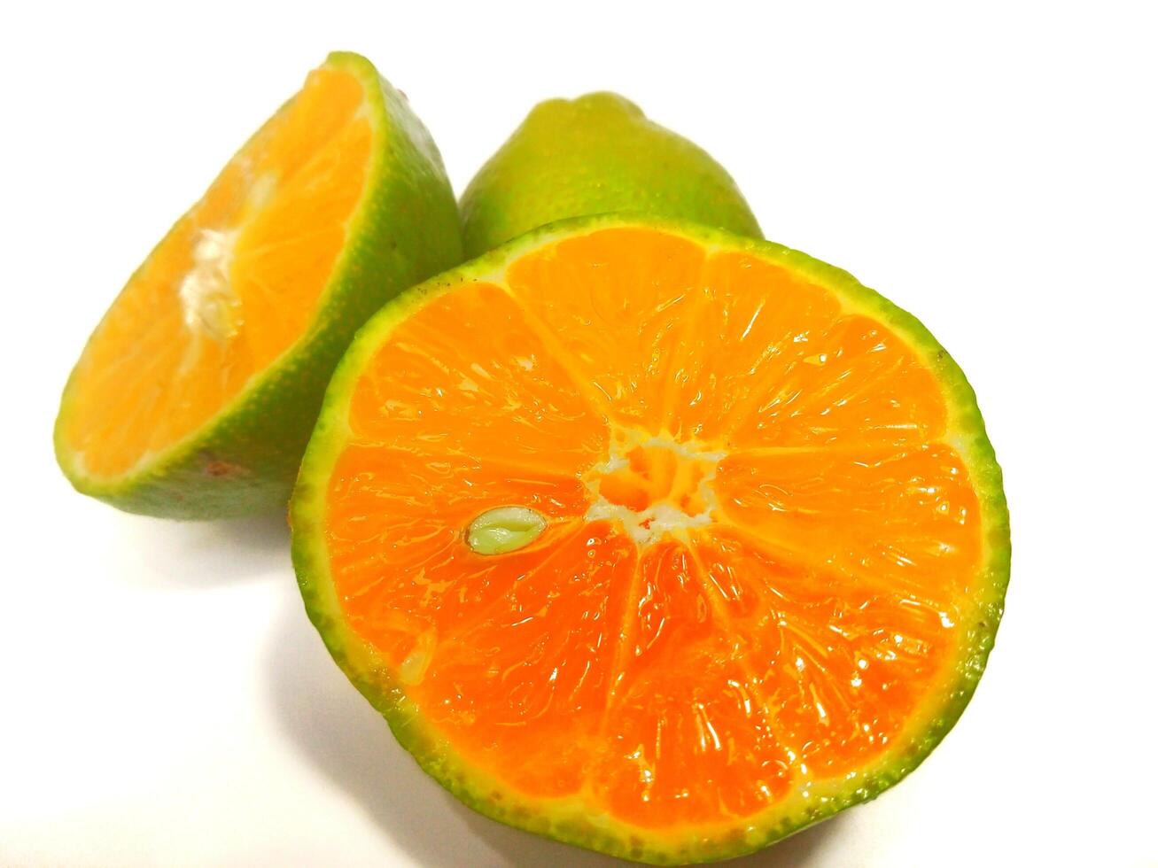 Lemon and slice isolated on white background. orange peel is green photo