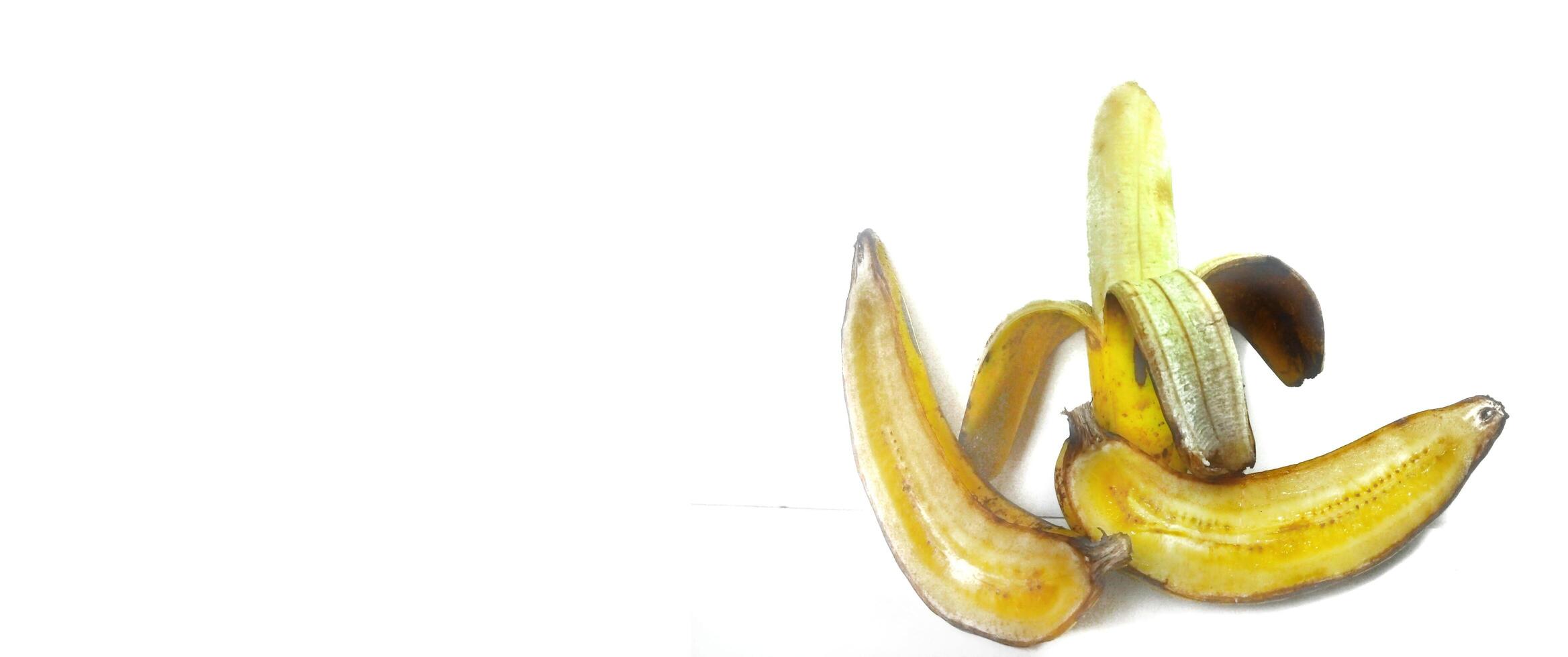 Three banana isolated. Ripe peeled banana on a white background with copy space photo