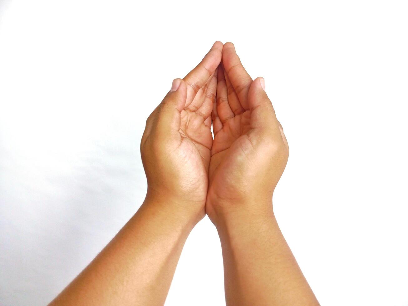 Religion. Man with open palms praying on white background, closeup photo