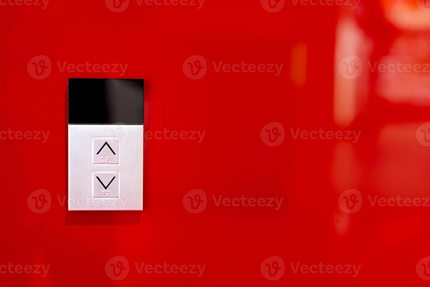 Elevator button on red wall. Elevator Button up and down direction with copy space. photo