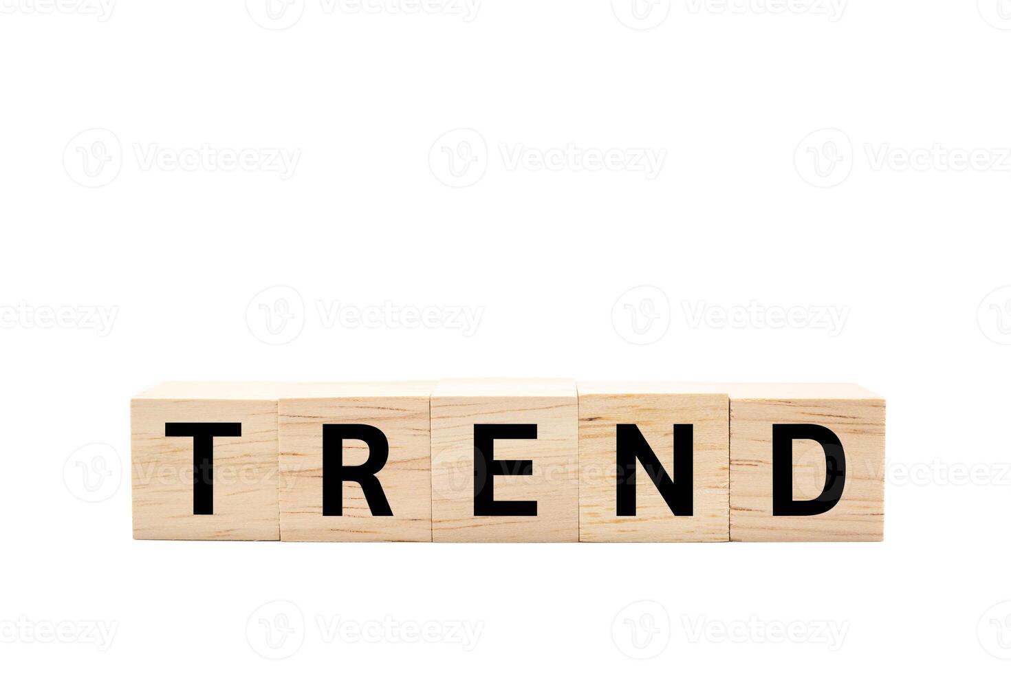 Wooden cube blocks with TREND text isolated on white background. TREND words. Copy space and Clipping path. photo