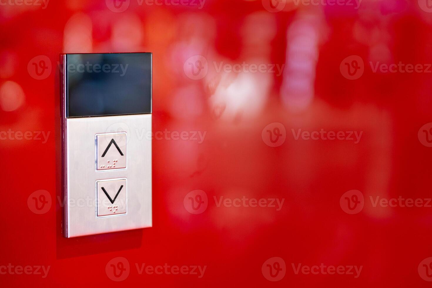 Elevator button on red wall. Elevator Button up and down direction with copy space. photo