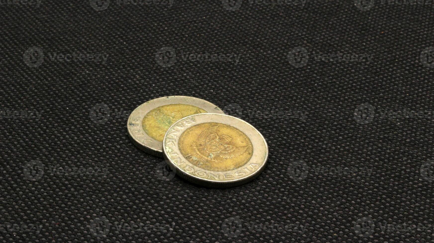 Old Indonesian one thousand rupiah coin isolated photo