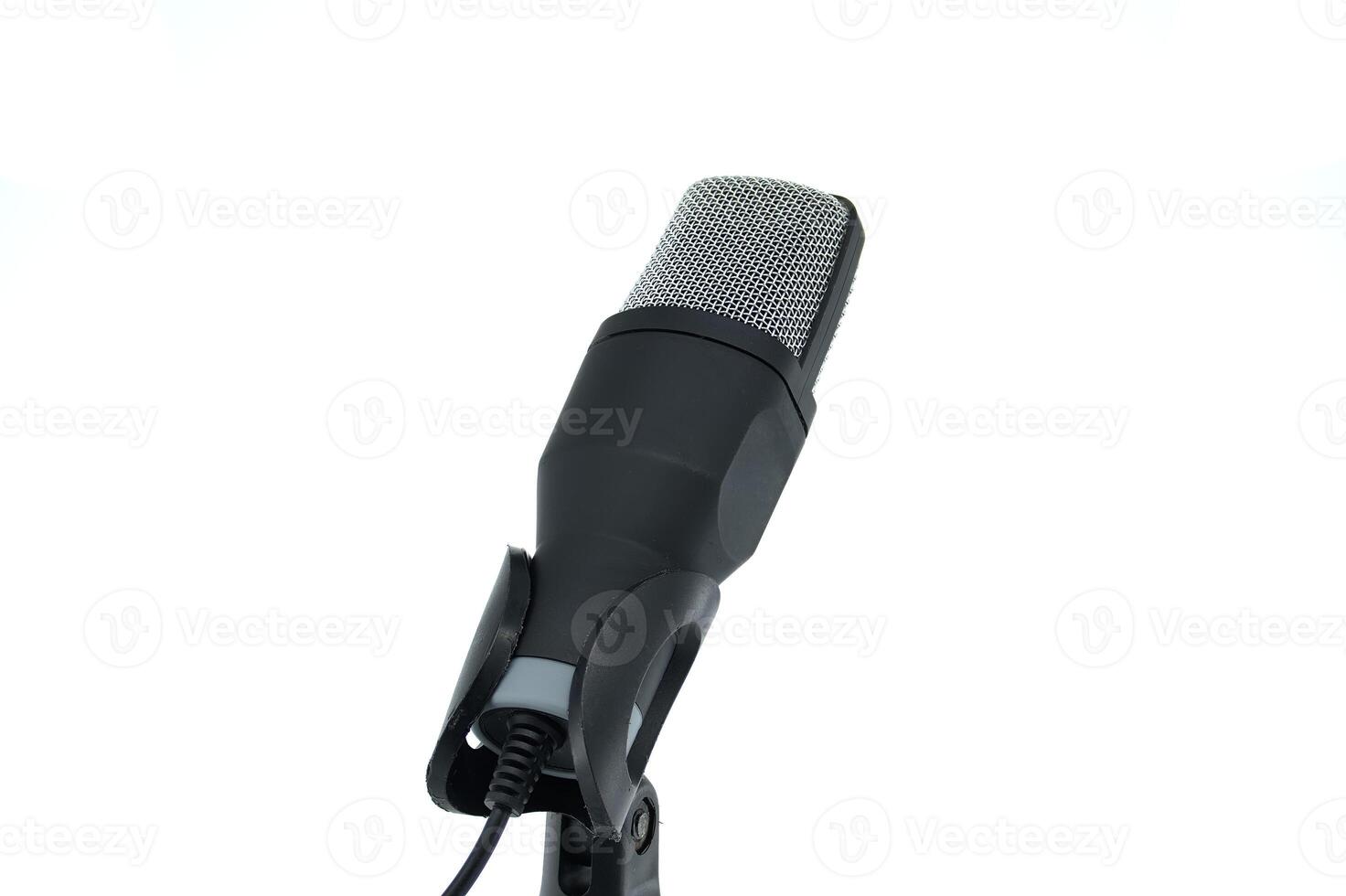 Close-up of a professional microphone on a stand, isolated on a white background photo