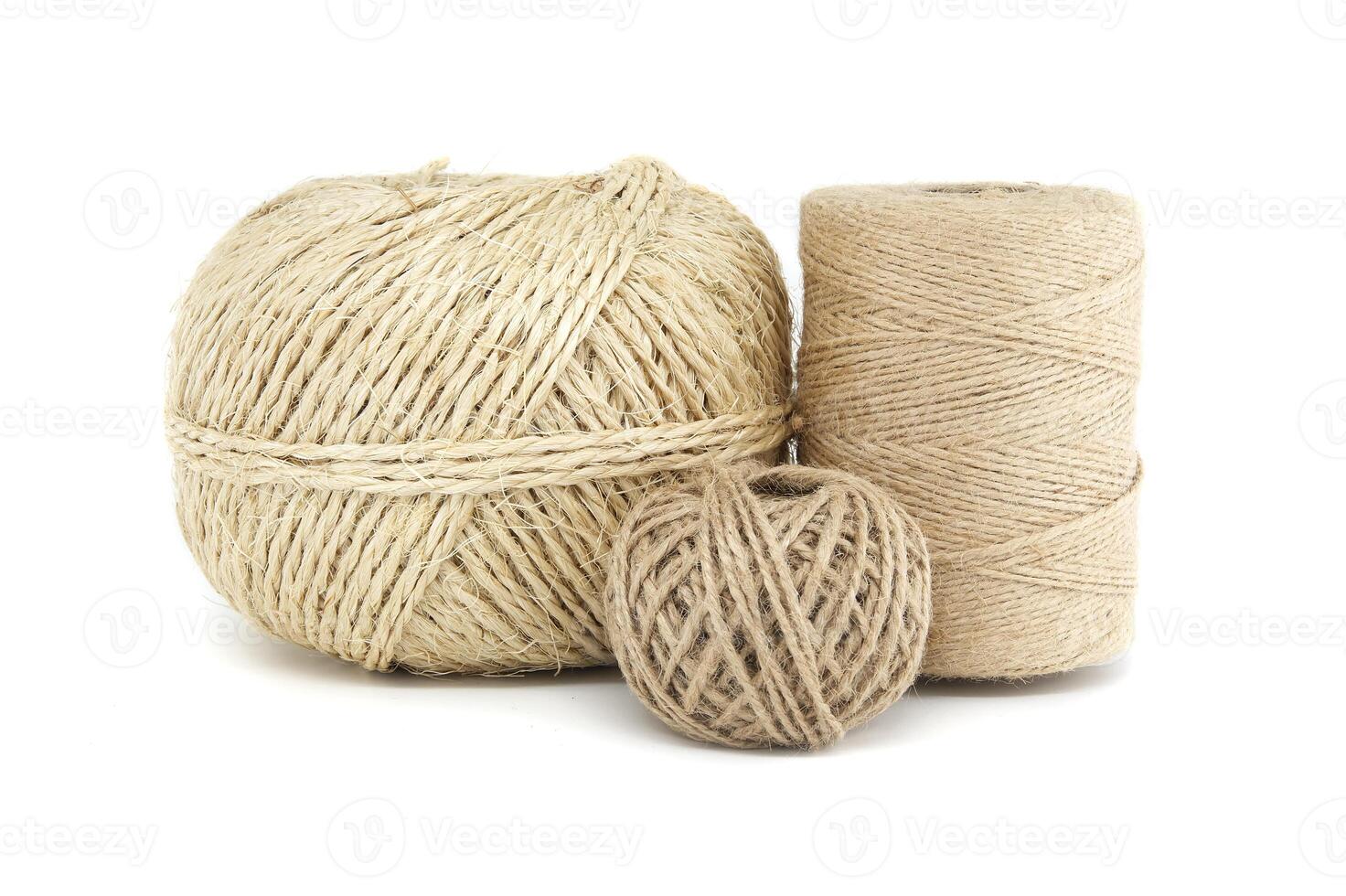 Collection of natural jute and burlap twine spools isolated on white background photo
