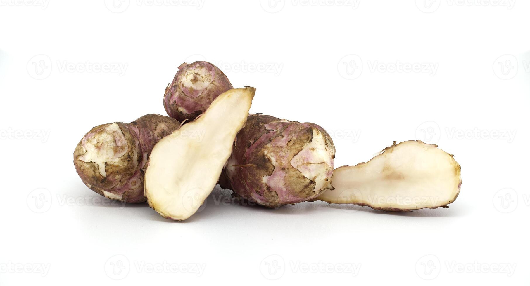Fresh raw Jerusalem artichokes isolated against a white background photo