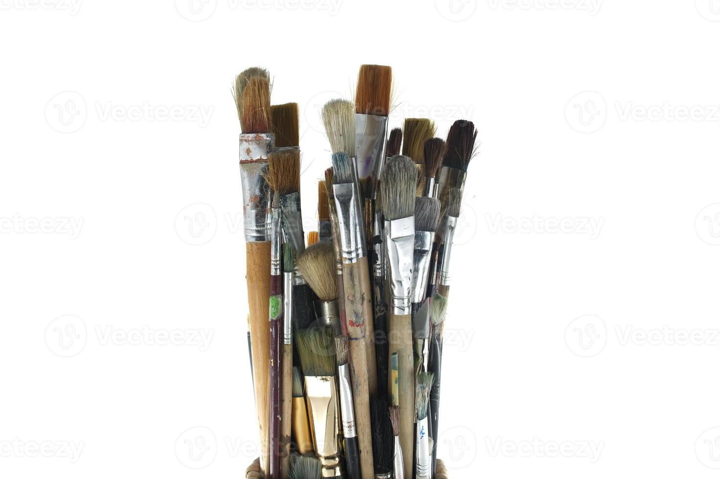 Paintbrushes of different sizes and colors isolated on white photo