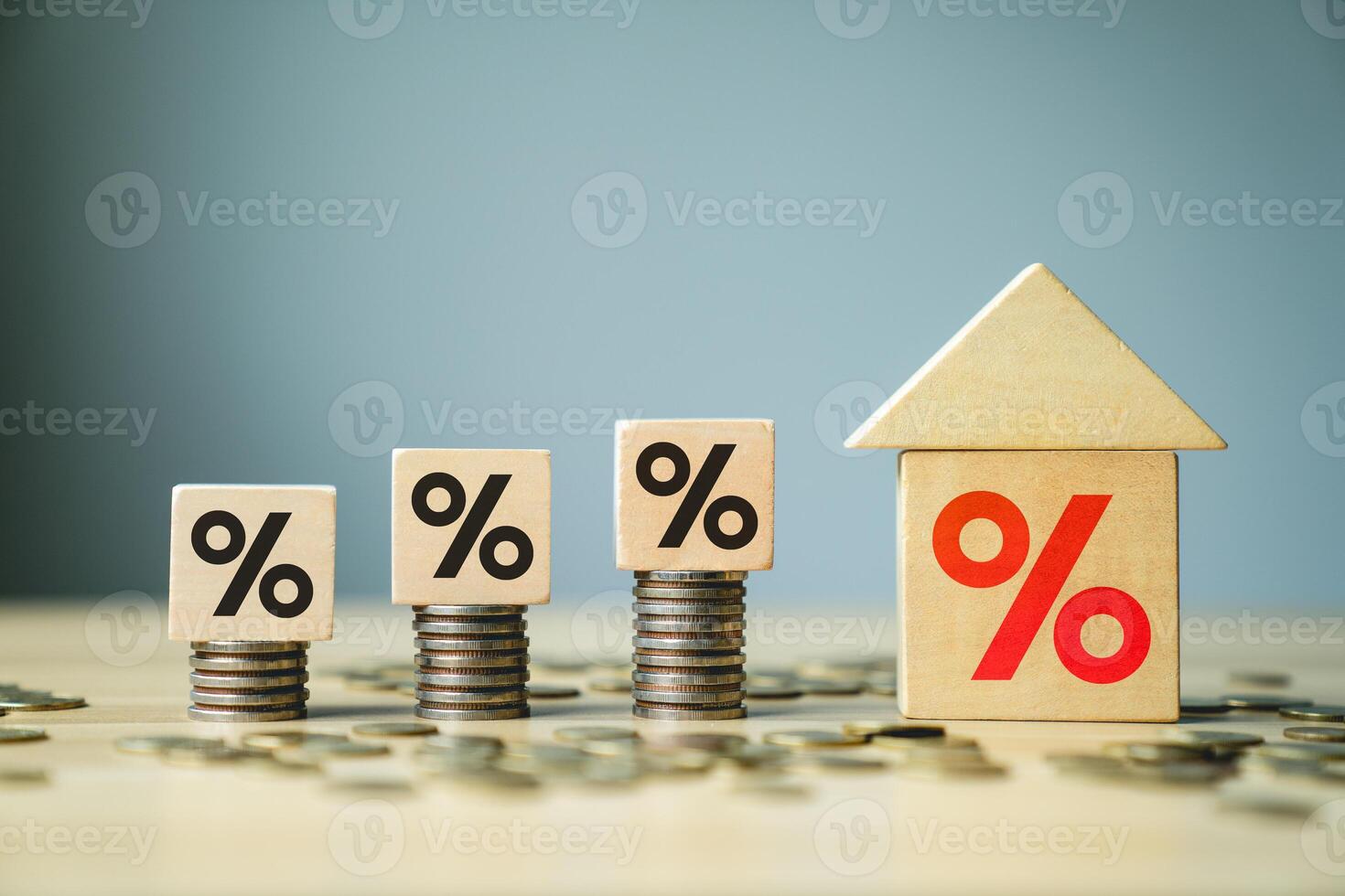 Rising Interest Rates and Mortgage Concept with Percent Symbols on Wooden Blocks and Stacks of Coins Representing Real Estate, Home Loans, and Financial Growth, housing borrowing costs rise photo