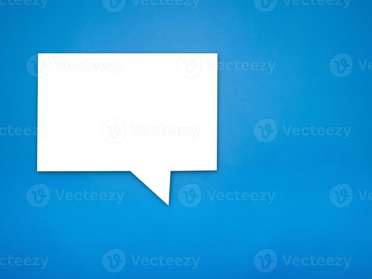 Blank white speech bubble part on a blue background photo