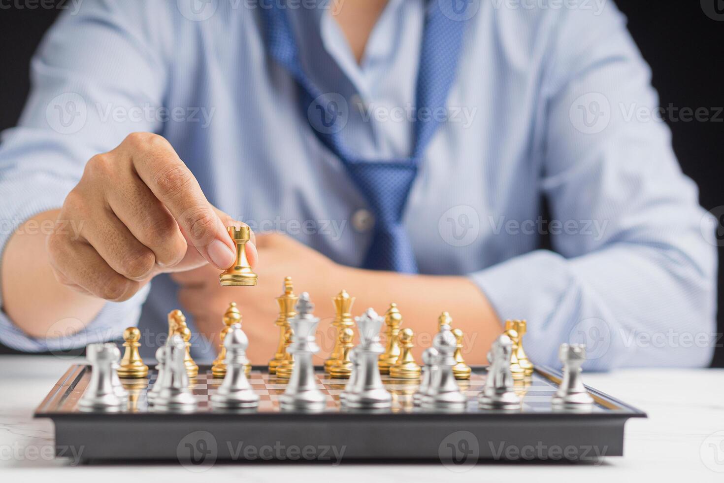 Businessman playing with chess game. Business strategy ideas and investment photo